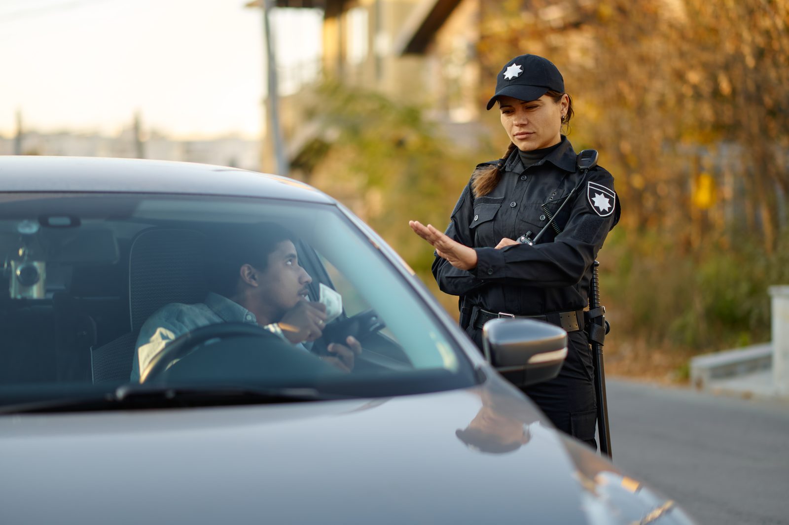 Police officer speaking with a driver during a traffic stop
